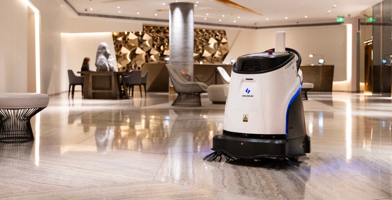 A Gausium Scrubber 50 auto-scrubber cleaning a hospital corridor