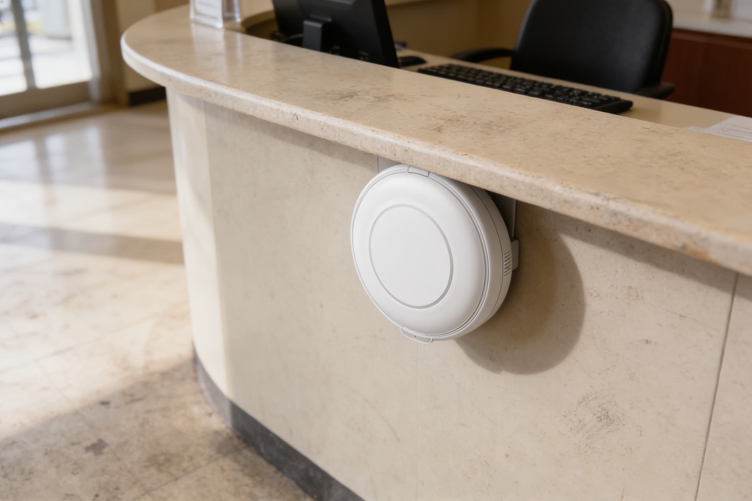 Panic button tucked under a hospital reception desk