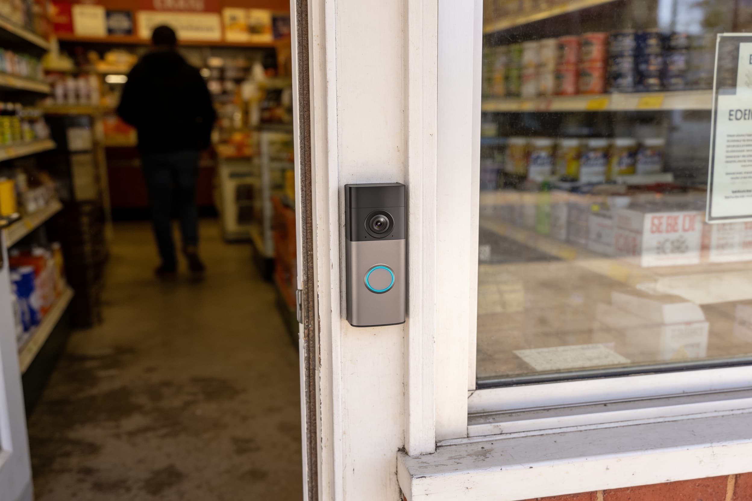 Video doorbell mounted at a small-shop entrance